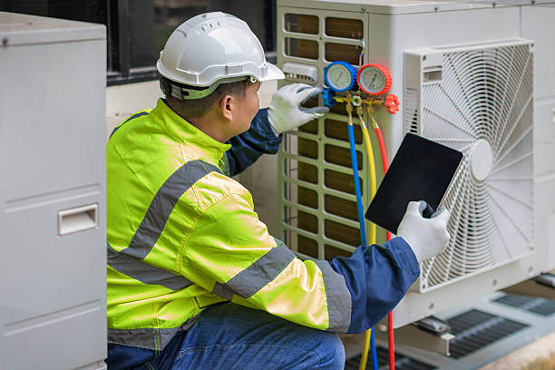 Professional Heat Pump Repair technician working in Grissom Arb, IN